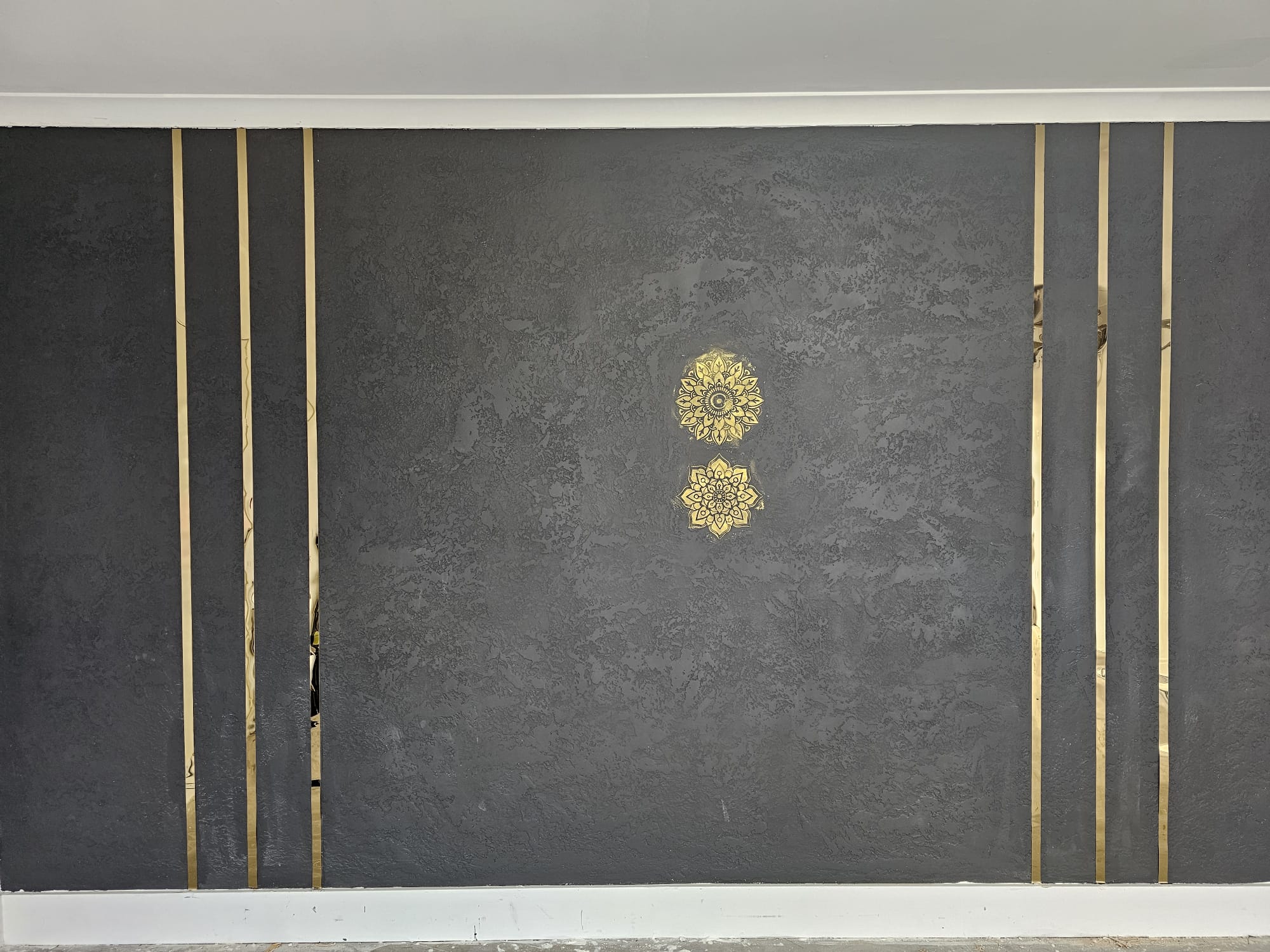 Grey texture wall finish with gold detailing